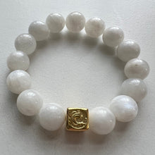 Load image into Gallery viewer, Welcome to the Elemental Elegance collection! Nature-inspired jewelry, where gemstones meet the timeless wisdom of the elements.  Water – serene and powerful, just like a flowing river, the calming allure of moonstone, lapis and aquamarine, reminding you to go with the flow and embrace life's currents with grace. Each moonstone  bracelet is made with real quality gemstones and a gold filled element bead