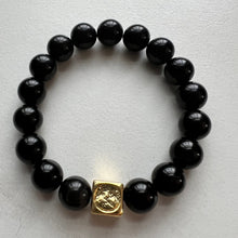Load image into Gallery viewer, Welcome to the Elemental Elegance collection! Nature-inspired jewelry, where gemstones meet the timeless wisdom of the elements. Earth – solid and steadfast. Black Tourmaline and tiger eye connect you to the earth's energy, reminding you to stay rooted in the present moment while nurturing your dreams from the ground up  Each black tourmaline  bracelet is made with real quality gemstones and a gold filled element bead