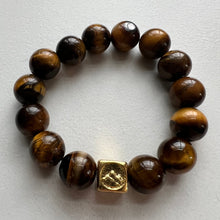 Load image into Gallery viewer, Welcome to the Elemental Elegance collection! Nature-inspired jewelry, where gemstones meet the timeless wisdom of the elements. Earth – solid and steadfast. Black Tourmaline and tiger eye connect you to the earth's energy, reminding you to stay rooted in the present moment while nurturing your dreams from the ground up  Each tiger eye  bracelet is made with real quality gemstones and a gold filled element bead