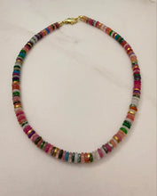 Load image into Gallery viewer, Multicolored beaded necklace on a light pink background