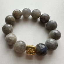 Load image into Gallery viewer, Welcome to the Elemental Elegance collection! Nature-inspired jewelry, where gemstones meet the timeless wisdom of the elements. Wind – gentle yet boundless. Labradorite and amethyst l encourage you to let your imagination soar and embrace the limitless possibilities that surround you.  Each labradorite bracelet is made with real quality gemstones and a gold filled element bead