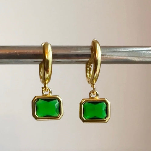 Small gold filled hoop earrings adorned with small green quartz charm are the perfect accessory to wear as a set or in a second or third piercing 