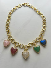 Load image into Gallery viewer, Discover the perfect blend of elegance and meaning with our stunning Charm Necklace! Measuring 17 inches, this piece features a luxurious gold-filled chain that beautifully complements the vibrant hues of five faceted gemstone heart charms.