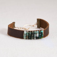 Load image into Gallery viewer, Absolutely stunning gemstone faceted stones hand wrapped with 14kt gold filled or sterling silver wire on a leather cuff with a gold filled or sterling silver lobster claw and chain closure. Bracelets measure seven inches but can be customized upon request. Can be customized with other gemstones upon request