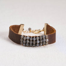 Load image into Gallery viewer, Absolutely stunning gemstone faceted stones hand wrapped with 14kt gold filled or sterling silver wire on a leather cuff with a gold filled or sterling silver lobster claw and chain closure. Bracelets measure seven inches but can be customized upon request. Can be customized with other gemstones upon request