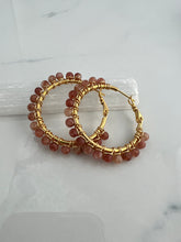 Load image into Gallery viewer, 1.5 inch 24kt gold filled hoops are hand wrapped with gorgeous faceted gemstones. These handcrafted earrings provide just the right amount of sparkle to make any outfit shine The earrings include AAA quality gemstones, they are natural, undyed, superbly faceted and vibrant