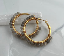 Load image into Gallery viewer, 2 inch 24kt gold filled hoops are hand wrapped with gorgeous faceted gemstones. These handcrafted earrings provide just the right amount of sparkle to make any outfit shine The earrings include AAA quality gemstones, they are natural, undyed, superbly faceted and vibrant
