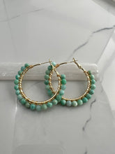 Load image into Gallery viewer, 2 inch 24kt gold filled hoops are hand wrapped with gorgeous faceted gemstones. These handcrafted earrings provide just the right amount of sparkle to make any outfit shine The earrings include AAA quality gemstones, they are natural, undyed, superbly faceted and vibrant