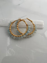 Load image into Gallery viewer, 1.5 inch 24kt gold filled hoops are hand wrapped with gorgeous faceted gemstones. These handcrafted earrings provide just the right amount of sparkle to make any outfit shine The earrings include AAA quality gemstones, they are natural, undyed, superbly faceted and vibrant