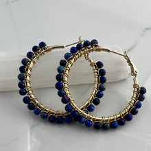 Load image into Gallery viewer, 1.5 inch 24kt gold filled hoops are hand wrapped with gorgeous faceted gemstones. These handcrafted earrings provide just the right amount of sparkle to make any outfit shine The earrings include AAA quality gemstones, they are natural, undyed, superbly faceted and vibrant