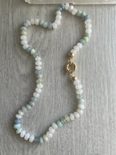Load image into Gallery viewer, Immerse yourself in the freshness and purity of the "Meggy" Necklace. Hand-knotted on white silk thread, this 18-inch necklace features moonstones, aquamarine, aventurine, and opals, creating a soothing and tranquil aura. The gold-filled end caps and sailor's clasp allow for easy on and off and personalization with your favorite charm. Embrace the freshness and elevate your style. Available now for purchase.