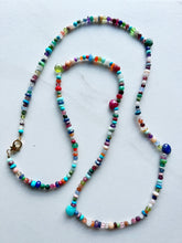 Load image into Gallery viewer, A multitude of miscellaneous gemstones for a necklace that is perfect for a white t shirt, bathing suit, sundress, blouse...you name it. Measures 30 inches and has a gold filled clasp to finish it off.   No two necklaces will ever be the same. If you have certain gemstones or colors you love please include in the notes. Length can be customized upon request