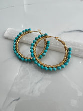 Load image into Gallery viewer, 1.5 inch 24kt gold filled hoops are hand wrapped with gorgeous faceted gemstones. These handcrafted earrings provide just the right amount of sparkle to make any outfit shine The earrings include AAA quality gemstones, they are natural, undyed, superbly faceted and vibrant