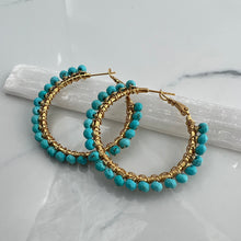 Load image into Gallery viewer, 2 inch 24kt gold filled hoops are hand wrapped with gorgeous faceted gemstones. These handcrafted earrings provide just the right amount of sparkle to make any outfit shine The earrings include AAA quality gemstones, they are natural, undyed, superbly faceted and vibrant