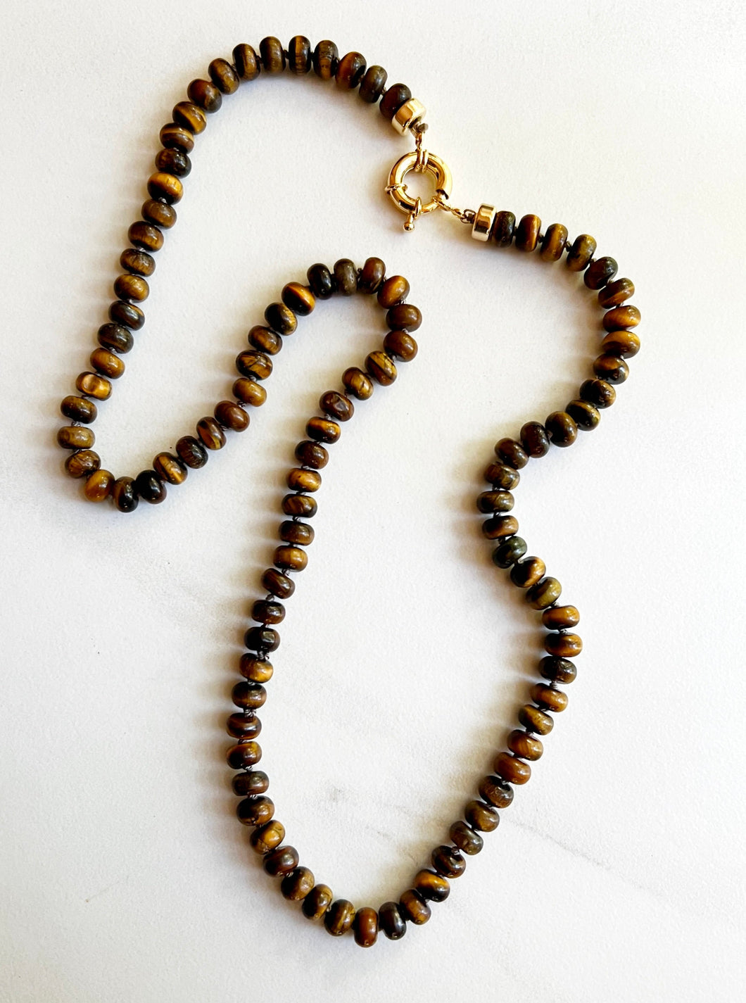 A stunning 26-inch tiger eye necklace, a symbol of courage and protection