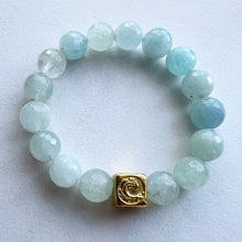 Load image into Gallery viewer, Welcome to the Elemental Elegance collection! Nature-inspired jewelry, where gemstones meet the timeless wisdom of the elements. Water – serene and powerful, just like a flowing river, the calming allure of moonstone, lapis and aquamarine, reminding you to go with the flow and embrace life&#39;s currents with grace. Each aquamarine bracelet is made with real quality gemstones and a gold filled element bead
