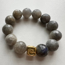 Load image into Gallery viewer, Welcome to the Elemental Elegance collection! Nature-inspired jewelry, where gemstones meet the timeless wisdom of the elements. Wind – gentle yet boundless. Labradorite and amethyst l encourage you to let your imagination soar and embrace the limitless possibilities that surround you.  Each labradorite bracelet is made with real quality gemstones and a gold filled element bead
