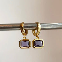 Load image into Gallery viewer, Small gold filled hoop earrings adorned with small purple quartz charm are the perfect accessory to wear as a set or in a second or third piercing 
