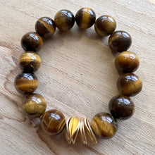 Load image into Gallery viewer, Made with 12mm gemstones and brushed gold plated copper discs these bracelets can be worn alone or with your favorite stack. Tiger eye, aquamarine, moonstone, howlite


Bracelets measure 7 inches but can be adjusted upon request 
