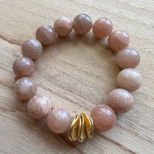 Load image into Gallery viewer, Made with 12mm gemstones and brushed gold plated copper discs these bracelets can be worn alone or with your favorite stack. Tiger eye, aquamarine, moonstone, howlite Bracelets measure 7 inches but can be adjusted upon request
