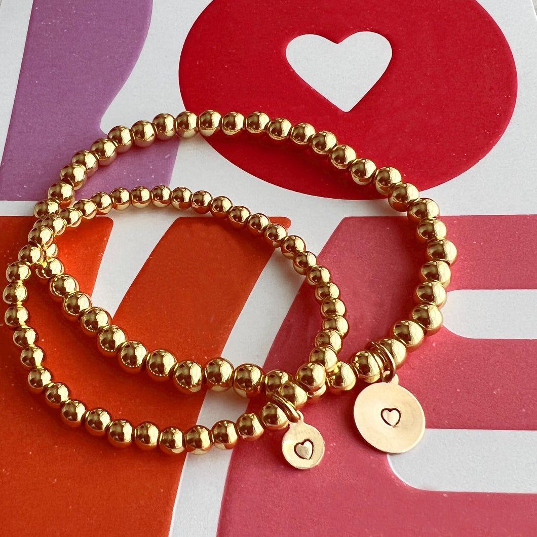 For the jewelry addict that wants to show her affection and share her love of hand crafted jewelry with her mini, this set is the perfect gift.  Mom’s bracelet features 5mm gold filled beads with a hand stamped 9mm heart charm and measures 7inches.  The mini bracelet measured 5.5 inches and has 4mm gold filled beads and 6mm hand stamped heart charm. 