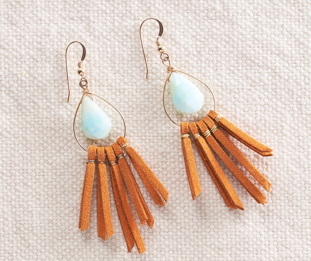 These light blue faceted peruvian opals are the perfect complement to the orangeish-brown leather fringe.   The color combo packs a punch and is a great way to add some fun to your outfit