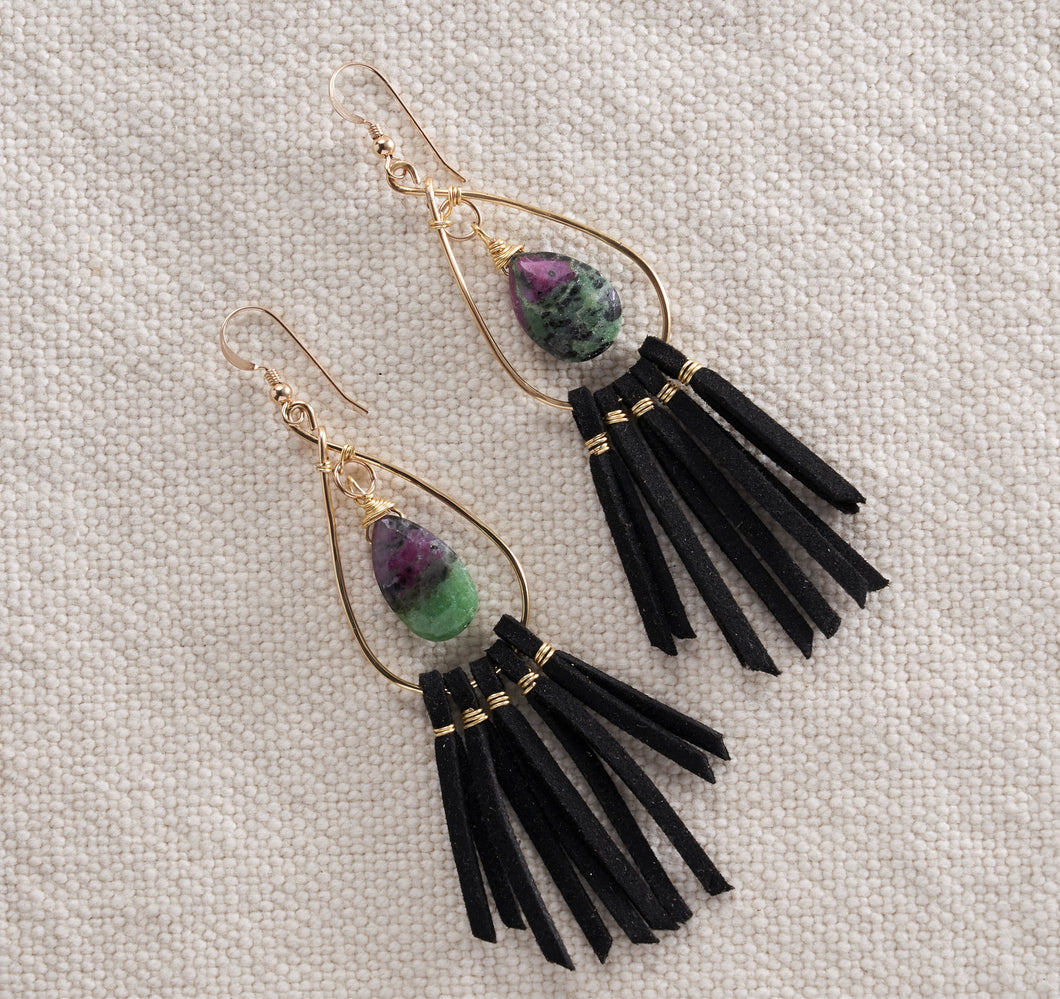 Most people are unfamiliar with this gorgeous stone, but the color and texture of the ruby zioste makes it stand out.  Paired with black leather fringe these earrings are sure to add style to any outfit