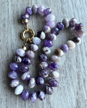 Load image into Gallery viewer, For the amethyst lover, these gorgeous 10mm faceted beauties are unforgettable.  Hand knotted on purple thread, this necklace measure 19 inches   Finished off with gold filled end caps and a gold filled sailor&#39;s clasp
