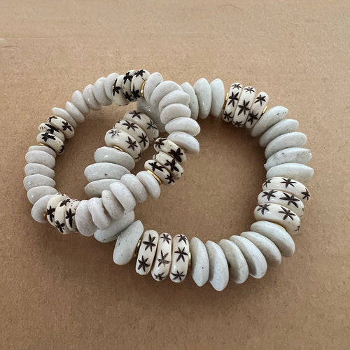 Matching bracelets with white ashanti beads with carved star bone beads Mommy bracelet measures seven inches but can be customized upon request.  Mini bracelet will be customized. Please mention child’s age in the notes (default will be six inches)