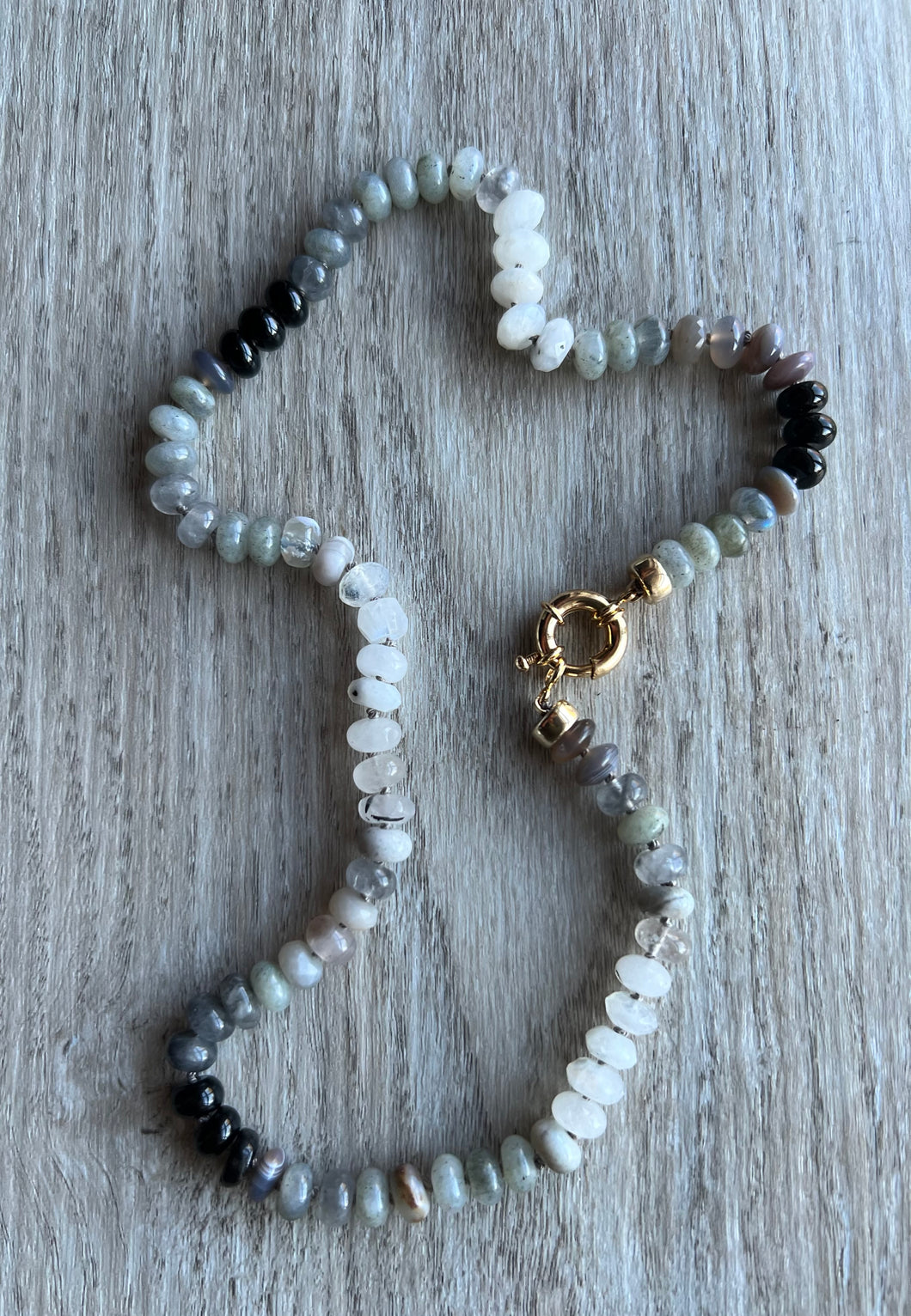 Inspired by a paint color way, this 20 inch beauty features moonstones, onyx,  labradorite and opals and is a gorgeous neutral piece to wear alone or as part of your favorite necklace stack   Finished off with gold filled end caps and a gold filled sailor's clasp