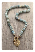 Load image into Gallery viewer, Discover the allure of the &quot;Aquamarine Bliss&quot; Necklace. Hand-knotted on silk thread, this 19-inch necklace features stunning 9mm faceted AAA quality aquamarines, radiating brilliance and elegance. The gold-filled sailor clasp allows for easy on and off and offers the perfect opportunity to add your favorite pendant. Elevate your style and attract attention with this exquisite piece. Shop now to experience the bliss of aquamarines.

