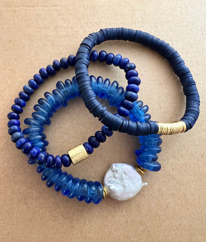 For the blues lover out there,  this stack features a blue recycled glass bracelet with a coin pearl accents stone, and blue polymer clay bracelet and a lapis lazuli bracelet   All bracelets measure 7 inches but can be customized upon request 