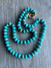Load image into Gallery viewer, Large faceted turquoise rondelles hand knotted on blue silk that measures 24 inches   Finished off with gold filled end caps and a gold filled sailor&#39;s clasp
